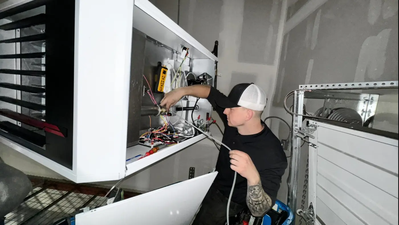 Carson Brender of AeroCool HVAC servicing an air handler